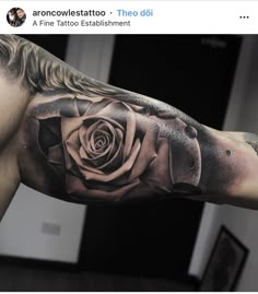 a man with a rose tattoo on his arm