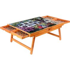 a wooden table with two trays on each side and pictures on the top,