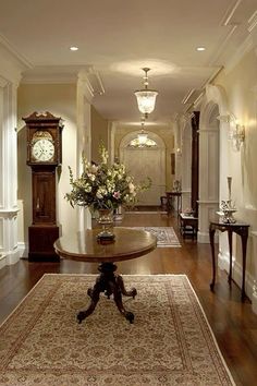 the hallway is clean and ready for guests to use it as an entrance way in this home