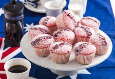 cupcakes and coffee on a plate with an american flag table cloth in the background