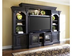 a living room with a large entertainment center