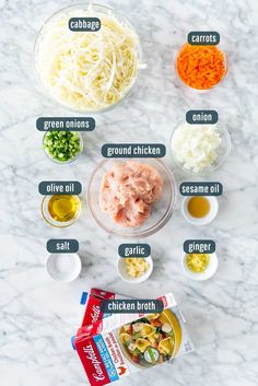 ingredients to make chicken parmesan casserole laid out on a marble counter top