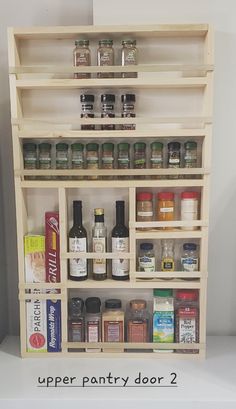 an open pantry door with spices and condiments