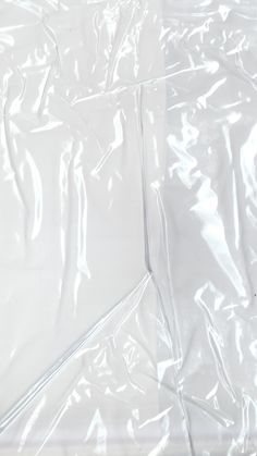 an image of clear plastic sheeting on the ground for use as a background or backdrop