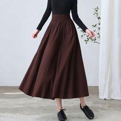 "★★ FEATURES * cotton linen skirt * no lining * Two side seam pockets * Wide elastic waistband * pleated waist detail * Plus size full skirt * A Line Skirt * Perfect for Spring Autumn * Wash by hand or machine with cold water ★★ The model is 170 cm (5′ 7″) tall with a 80 cm (31.5\") bust, 66 cm (26\") waist. She is wearing the brown linen skirt in size XS. ★★ Please select custom order according to the follow situation Your height is not between 155 cm- 172 cm Your weight is over 75 kg Request t Baggy Solid Skirt For Fall, High Waist Brown Maxi Skirt For Fall, Non-stretch Long Brown Skirt, Non-stretch Brown Long Skirt, Fall Cotton Flared Skirt, Baggy Pleated Skirt For Fall, Non-stretch Maxi Skirt For Fall, High Waist Skirt With Elastic Waistband For Fall, Baggy Skirt For Fall