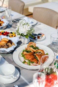 the table is set with many different types of food