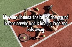 a woman laying on top of a tennis court holding a racquet and ball