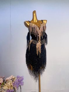 a black and gold flap dress on display