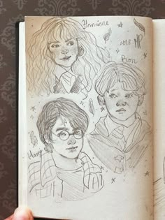 a hand holding an open book with drawings of harry potter and hermione hogwarts