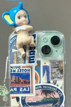 a cell phone case with an image of a baby doll on top of the cover