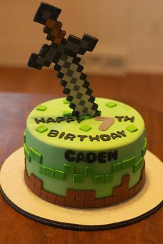 a birthday cake decorated with an image of a pixel