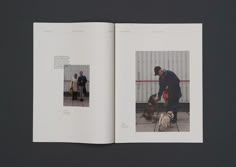 an open book with two people and three dogs