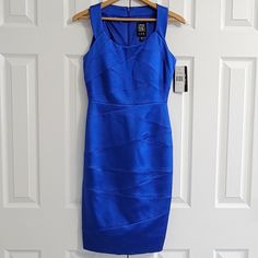 Jax Electric Blue Bandage Bodycon Sheath Cocktail Dress Women's Size 2 New With Tags! Sexy And Elegant Form Fitting Cobalt Blue Cocktail Dress. Sleeveless Scoop Neck Back Zip Fully Lined Shell: 68% Acetate, 29% Nylon, 3% Spandex Lining: 100% Polyester Sleeveless Blue Bodycon Bandage Dress, Blue Sleeveless Bodycon Bandage Dress, Blue Fitted Sleeveless Dress For Evening, Sleeveless Blue Bandage Dress For Evening, Blue Fitted Sheath Sleeveless Dress, Blue Fitted Sleeveless Sheath Dress, Elegant Blue Sleeveless Bandage Dress, Cobalt Blue Cocktail Dress, Blue Cocktail Dress