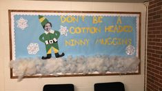 a bulletin board is decorated with cotton flakes and a dr seusse hat