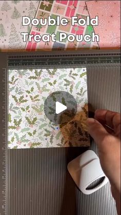 someone is making a paper christmas card with the words, double fold treat pouch