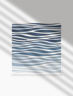 an abstract blue and white painting with wavy lines in the center, on a light gray background