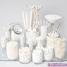 there are many different types of candies in glass containers