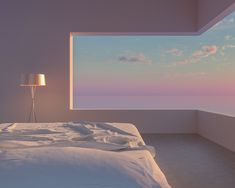 a bedroom with a large window overlooking the ocean at sunset or sunrise, is shown in this image