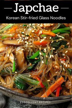 the cover of japanese korean stir - fried glass noodles with sesame seeds and carrots