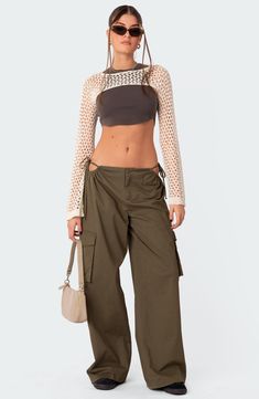 Stand out in streetwear-inspired style with these roomy cargo pants featuring flirty side cutouts, handy pockets and a low rise for a 2000s-inspired look. 100% cotton Machine wash, dry flat Imported Cargo Outfits Women Summer, Parashoot Pants Outfit, Low Waist Cargo Pants, 2023 Pants, Cargo Pants Low Rise, Fits Check, Best Cargo Pants, Cutout Pants, Woman Streetwear