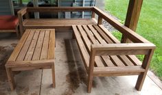 a wooden bench sitting on top of a patio