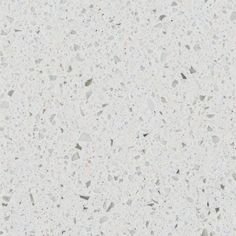 a white counter top with lots of speckles on it