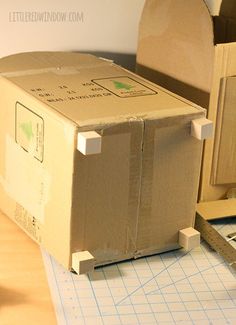 an open box sitting on top of a table next to a computer mouse and keyboard