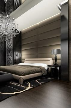 a bedroom with a large bed and chandelier hanging from the ceiling