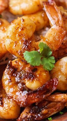 some shrimp and rice on a plate with cilantro