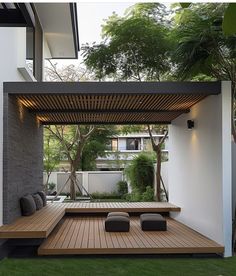 an outdoor living area with wooden flooring and benches