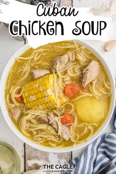 a bowl of chicken soup with corn on the cob