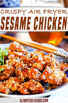 crispy air fryer sesame chicken on a plate with chopsticks next to it