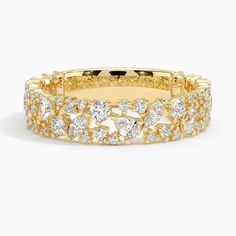 a yellow gold ring with diamonds on it