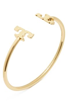 Logo details add a refined finishing touch to this goldtone cuff bracelet. 1/8" - 1/2" width Goldtone plate Imported Rush Jewelry, October Jewelry, Tory Burch Bracelet, Gold Cuff Bracelet, Tory Burch Jewelry, Dope Jewelry, Classy Jewelry