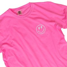 Looking for a neon pink lightning bolt happy face shirt this summer? Look no further! This happy face checkerboard tee is perfect for showing your love for all things preppy and trendy. Made from 100% cotton, this shirt will brighten up your wardrobe and you'll want to wear all year round! This is your ultimate beach summer t-shirt. Fabric: 100% Cotton Design: White heat-applied vinyl Color: Neon Pink (shirt colors are pigment dyed) Colors will vary from computer to computer and monitor to monit Neon Pink Lightning Bolt, Neon Pink Shirt, Neon Pink Shirts, Pink Shirt Outfit, Pink Lightning Bolt, Happy Face Shirt, Pink Lightning, Preppy Tee, Smiley Face Shirt