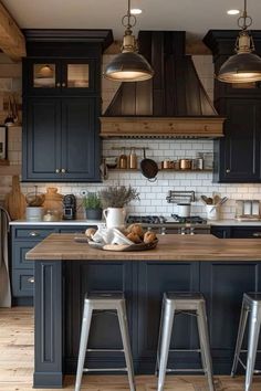 a kitchen with two stools and an island in front of the stove top oven