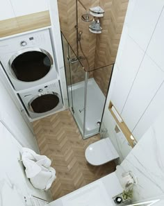 an overhead view of a bathroom with a toilet, sink and washer dryer