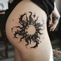 This detailed black sun tattoo on the hip incorporates stars and delicate shading, creating a celestial and unique tattoo design. Perfect for those who love cosmic themes in their body art. Discover more sun tattoo designs at inktat2.com. Goth Sun And Moon Tattoo, Moon Tattoo On Hip, Moon And Stars Hip Tattoo, Female Sun Tattoo, Celestial Thigh Tattoo, Gothic Sun Tattoo, Sunflower And Stars Tattoo, Shading Tattoo Ideas, Sun And Moon Hip Tattoo