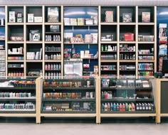 a store filled with lots of different types of items and bottles on shelves next to each other