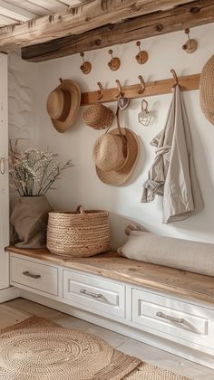 a room with some baskets and hats on the wall