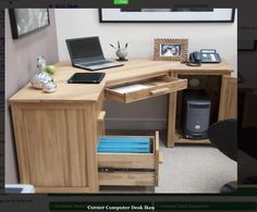 a laptop computer sitting on top of a wooden desk next to a printer and mouse