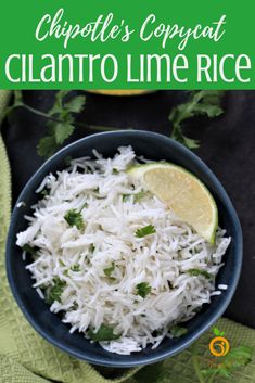 a bowl filled with white rice and cilantro on top of a green towel