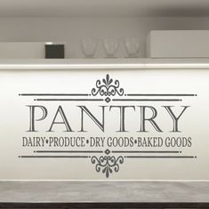 the pantry sign is on the wall above the counter