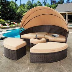 an outdoor patio furniture set near a swimming pool