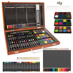 an open wooden box filled with lots of art supplies