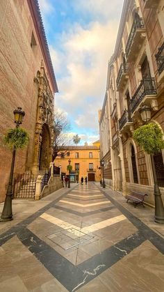 an empty street with people walking down it