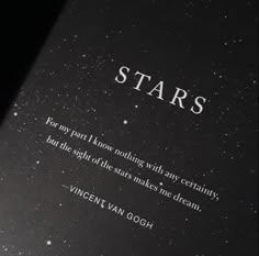 an open book with the words stars written in white and black ink on it's cover