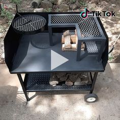 an outdoor bbq grill with logs on it