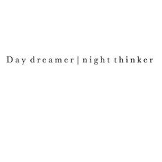 the words daydreamer / night thinker are in black on a white background