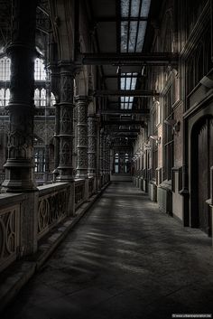 an old building with many windows and railings